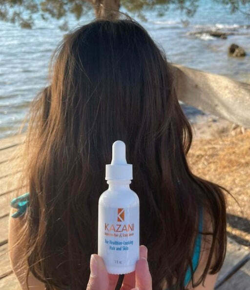 Kazani Hair and Scalp Serum with long hair girl in the back