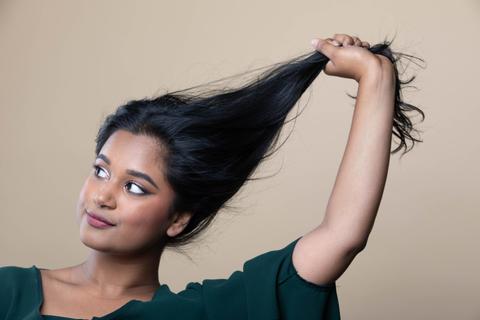 Indian Woman Holding Her Hair with Left Hand
